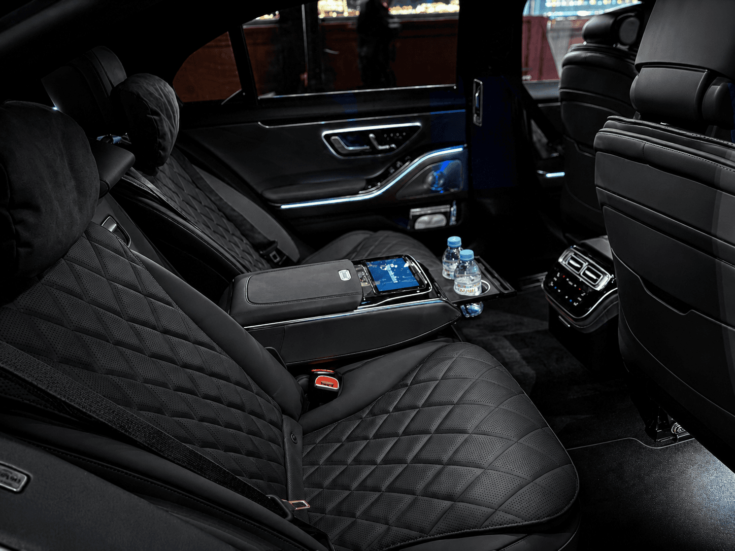 Luxury vehicle interior — plush leather seats with ambient lighting